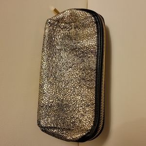 Trina make up bag gold speckle, black inside and black trim around zipper